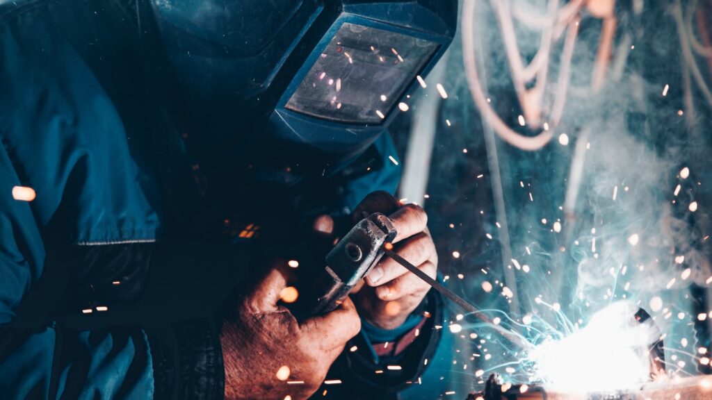 man using welding machine